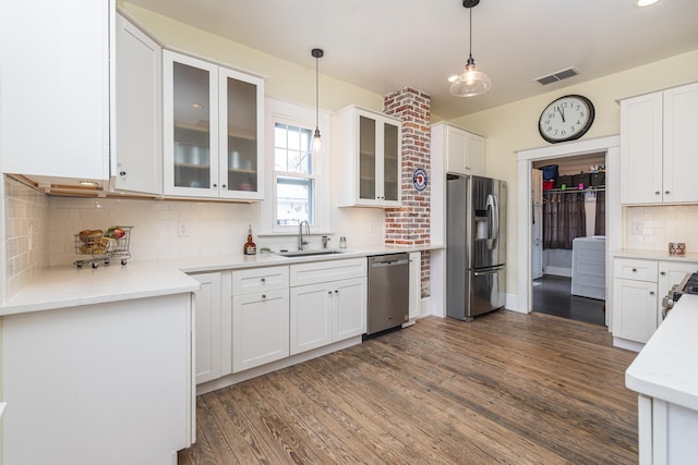 60 Saragossa St, Saint Augustine, FL 32084 - kitchen featuring stainless steel appliances, dark wood-type flooring, a sink, visible vents, and white cabinets