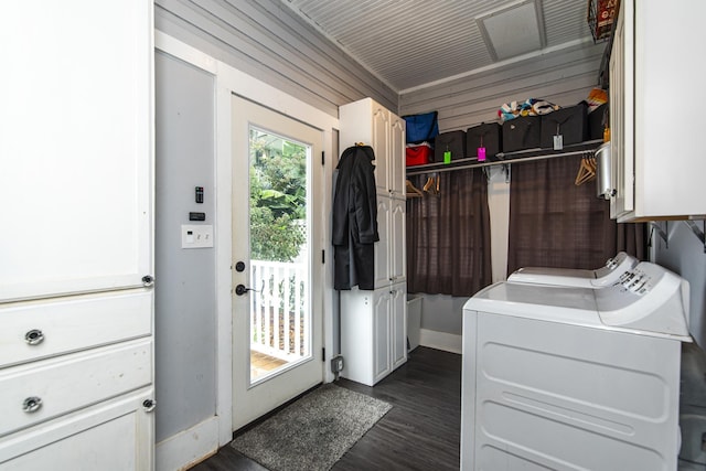 60 Saragossa St, Saint Augustine, FL 32084 - clothes washing area featuring washer and dryer, cabinet space, dark wood finished floors, and baseboards