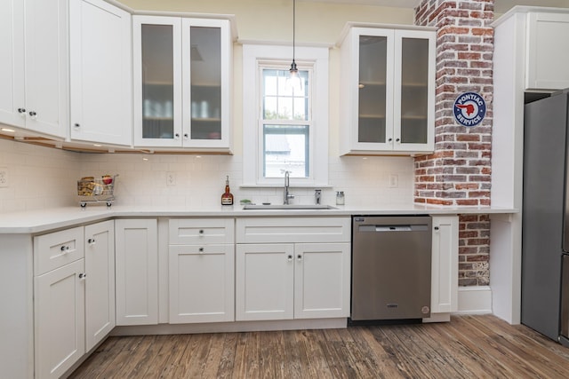60 Saragossa St, Saint Augustine, FL 32084 - kitchen featuring a sink, white cabinets, light countertops, appliances with stainless steel finishes, and dark wood-style floors