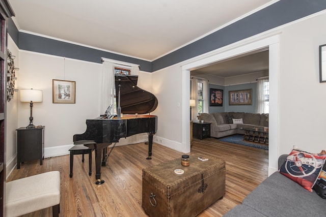 60 Saragossa St, Saint Augustine, FL 32084 - sitting room with ornamental molding, baseboards, and wood finished floors