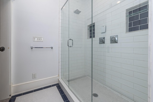 60 Saragossa St, Saint Augustine, FL 32084 - bathroom with a stall shower, baseboards, and tile patterned floors