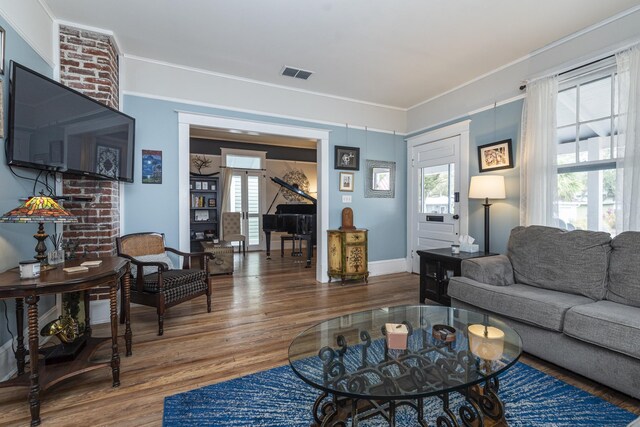60 Saragossa St, Saint Augustine, FL 32084 - living room featuring baseboards, visible vents, and wood finished floors
