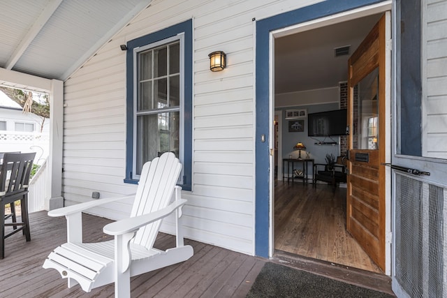 60 Saragossa St, Saint Augustine, FL 32084 - wooden deck featuring a porch and visible vents