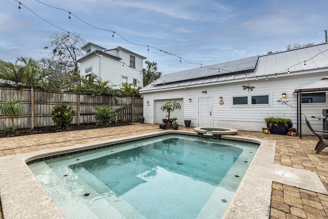 60 Saragossa St, Saint Augustine, FL 32084 - view of swimming pool featuring a patio, fence, and a pool with connected hot tub