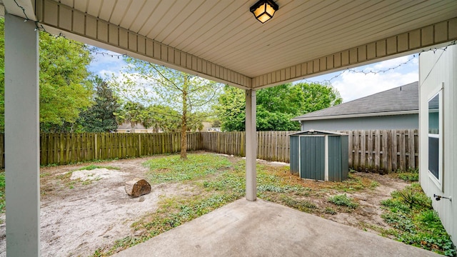 191 Timberwood Dr, Saint Augustine, FL 32084 - view of yard featuring an outdoor structure, a fenced backyard, a patio area, and a storage shed