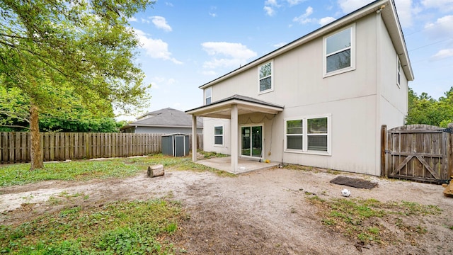 191 Timberwood Dr, Saint Augustine, FL 32084 - rear view of property with a gate, a patio, a fenced backyard, an outbuilding, and a shed