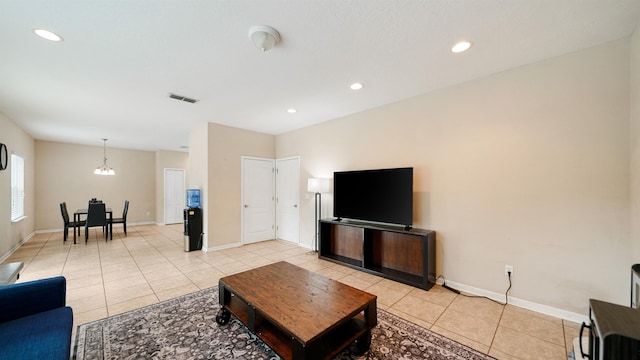 191 Timberwood Dr, Saint Augustine, FL 32084 - living area featuring light tile patterned flooring, baseboards, visible vents, and an inviting chandelier