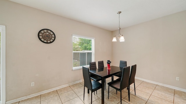 191 Timberwood Dr, Saint Augustine, FL 32084 - dining space featuring light tile patterned floors, a notable chandelier, and baseboards