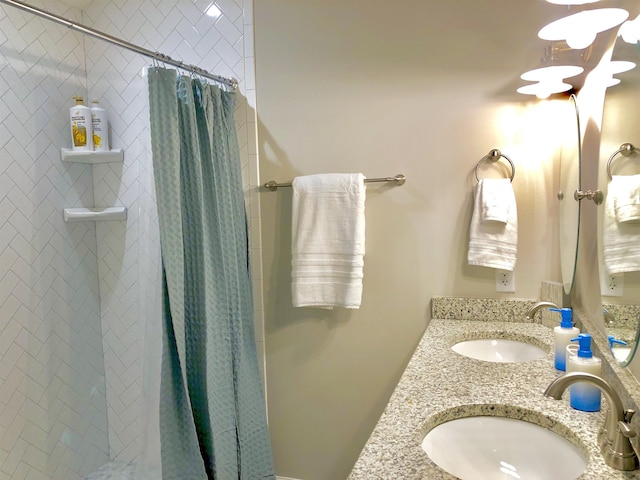 3877 Laurel St, Saint Augustine, FL 32084 - full bathroom with a tile shower and double vanity