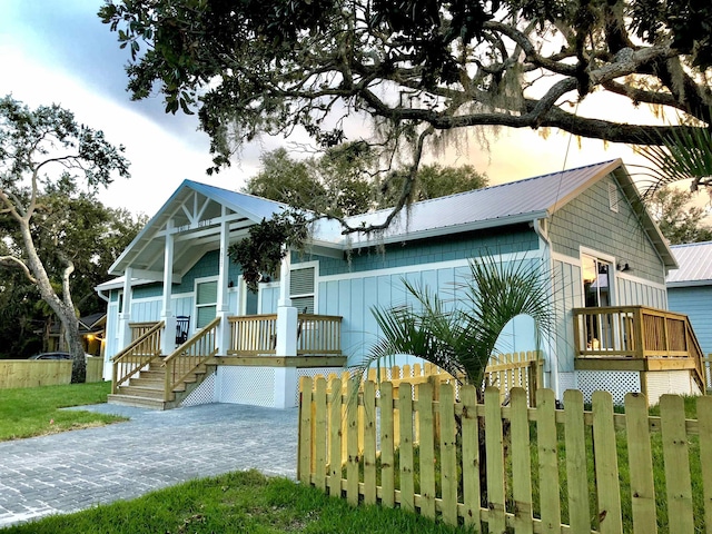 3877 Laurel St, Saint Augustine, FL 32084 - view of front facade with metal roof and a porch