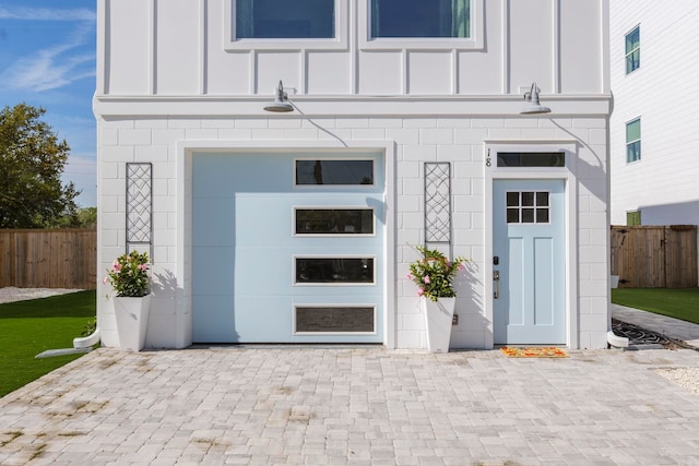 doorway to property featuring a garage