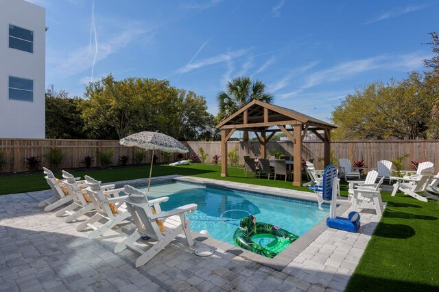 view of swimming pool featuring a gazebo, a patio, and a lawn