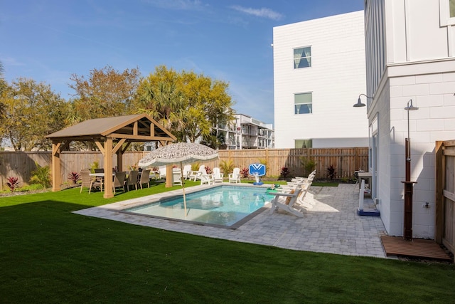 view of swimming pool with a gazebo, a patio area, and a lawn