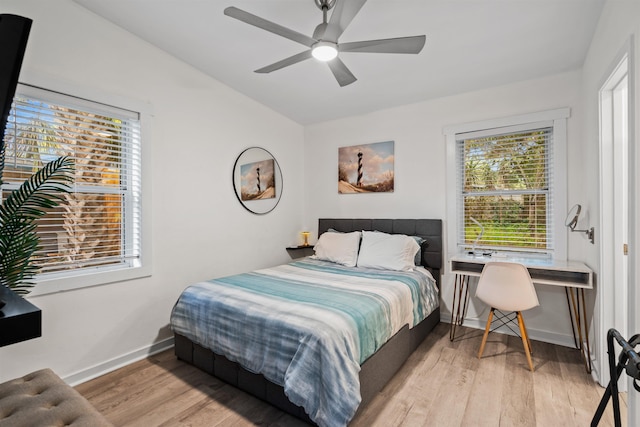 bedroom featuring light hardwood / wood-style floors and ceiling fan