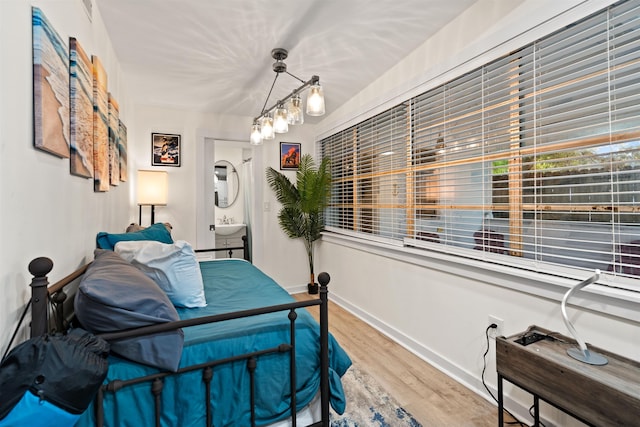 bedroom with hardwood / wood-style flooring