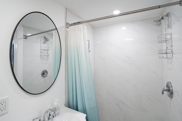 bathroom featuring sink and a shower with shower curtain