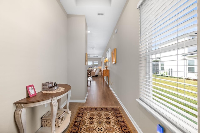 corridor with hardwood / wood-style floors