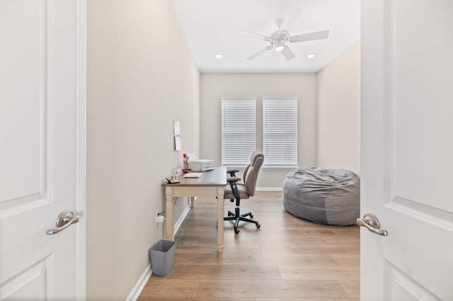 office space with light wood-type flooring and ceiling fan