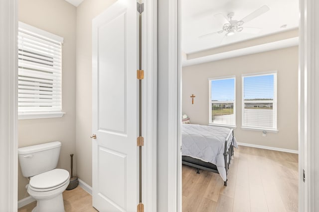 bedroom with light wood-type flooring and ceiling fan