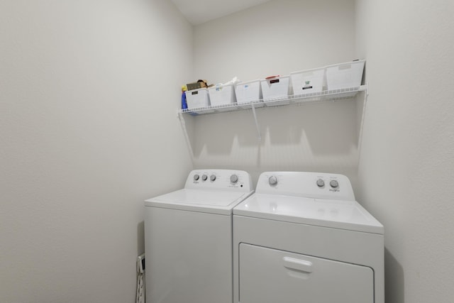 laundry room with washer and dryer