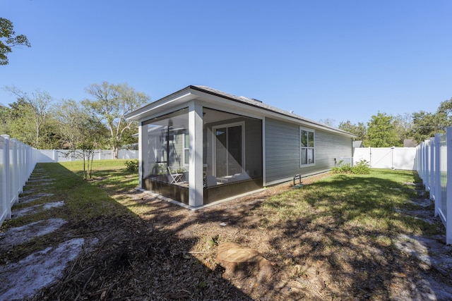 back of house with a sunroom