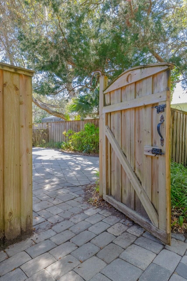 view of outdoor structure with a gate and fence