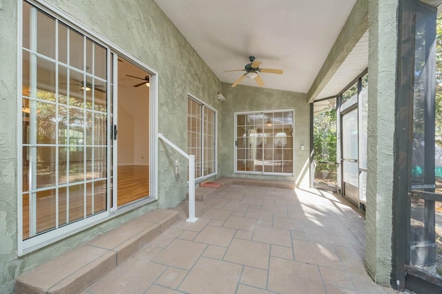 view of patio featuring ceiling fan