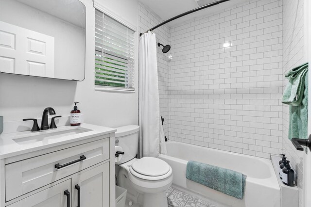 full bathroom with toilet, vanity, and shower / bath combination with curtain