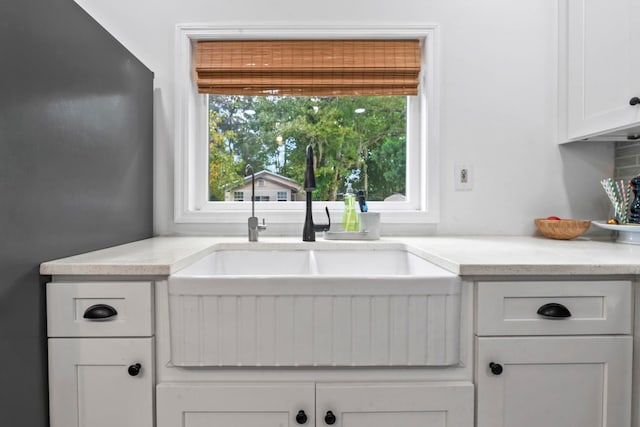 kitchen with white cabinets and a sink