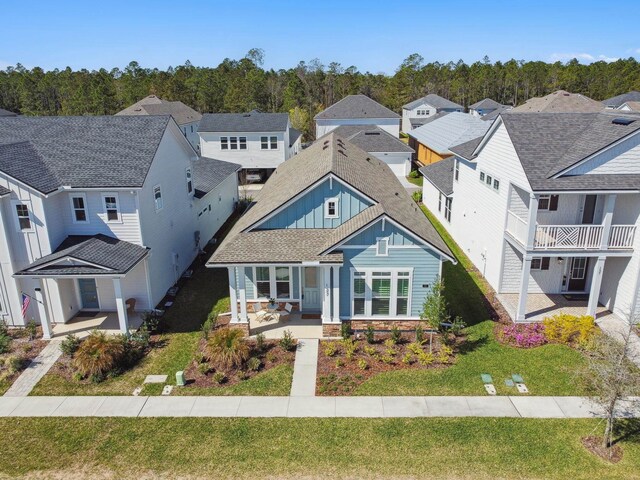 birds eye view of property with a residential view