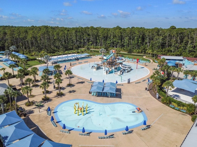 bird's eye view featuring a wooded view