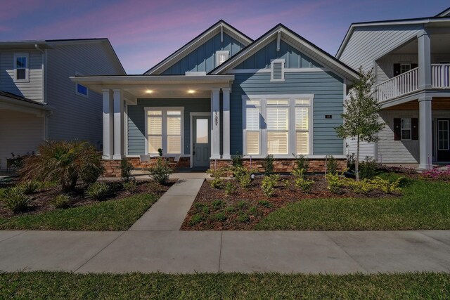 view of front of home featuring covered porch and board and batten siding