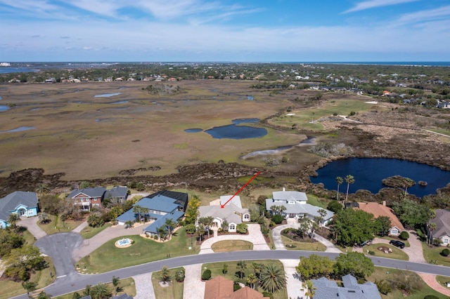 aerial view with a residential view and a water view