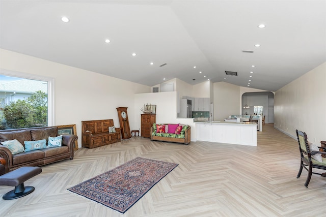 living room featuring visible vents, high vaulted ceiling, and recessed lighting