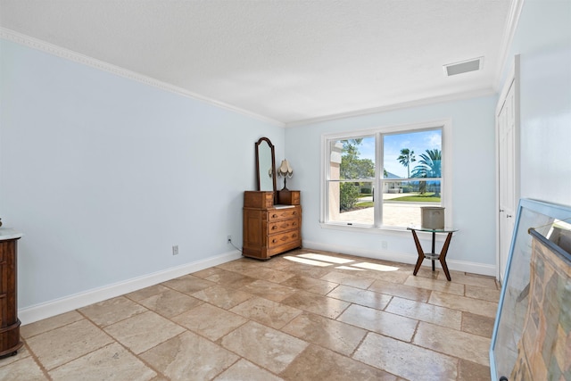 interior space featuring a textured ceiling, visible vents, baseboards, stone tile flooring, and crown molding