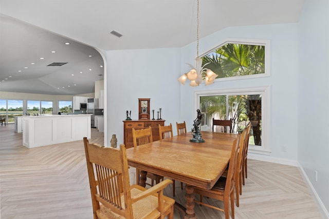 dining area featuring baseboards, visible vents, a chandelier, high vaulted ceiling, and recessed lighting