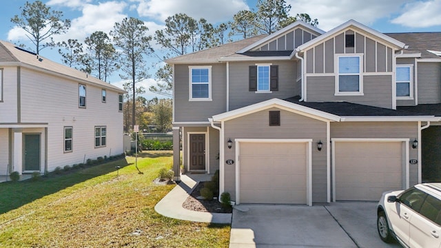 view of front of home with a garage and a front lawn