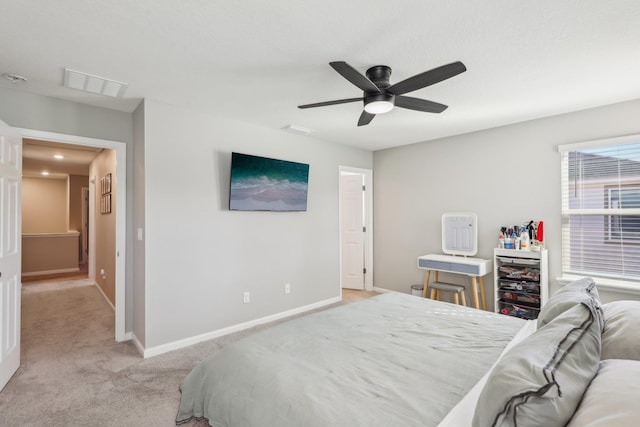 bedroom with light colored carpet and ceiling fan