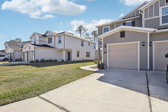 view of front of property featuring a garage and a front yard