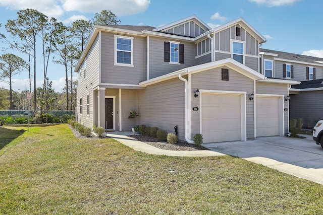 view of front of property with a garage and a front lawn