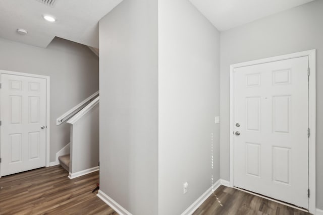 entryway with dark hardwood / wood-style floors