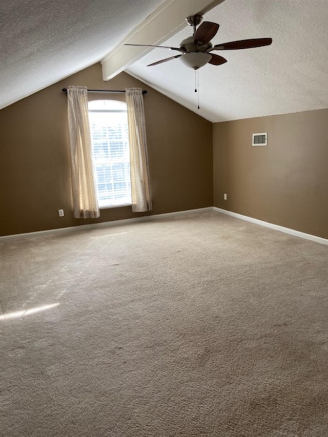 bonus room with vaulted ceiling with beams, ceiling fan, carpet, and a textured ceiling