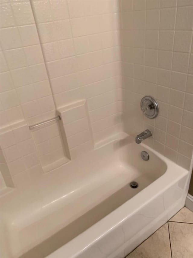 bathroom with  shower combination and tile patterned floors