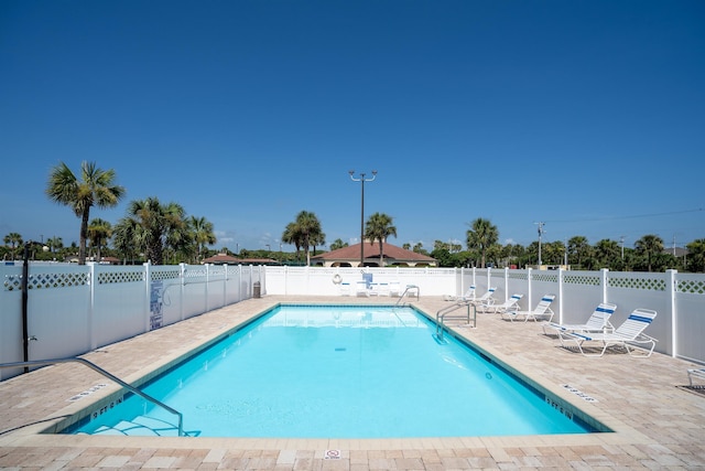 view of swimming pool featuring a patio area