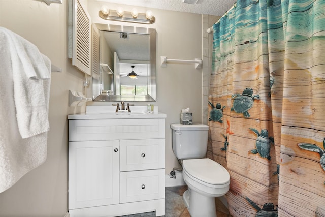 bathroom featuring vanity, a textured ceiling, toilet, and curtained shower