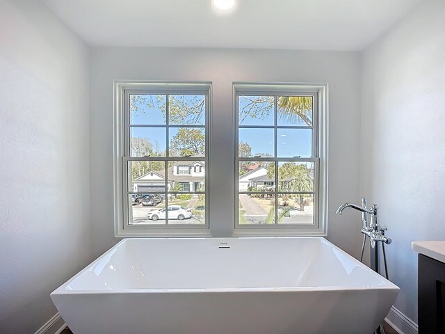 307 Minorca Ave, Saint Augustine, FL 32080 - bathroom with a wealth of natural light, vanity, and a freestanding tub