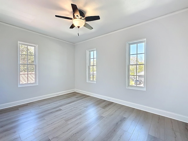 307 Minorca Ave, Saint Augustine, FL 32080 - empty room with dark wood finished floors, a ceiling fan, crown molding, and baseboards
