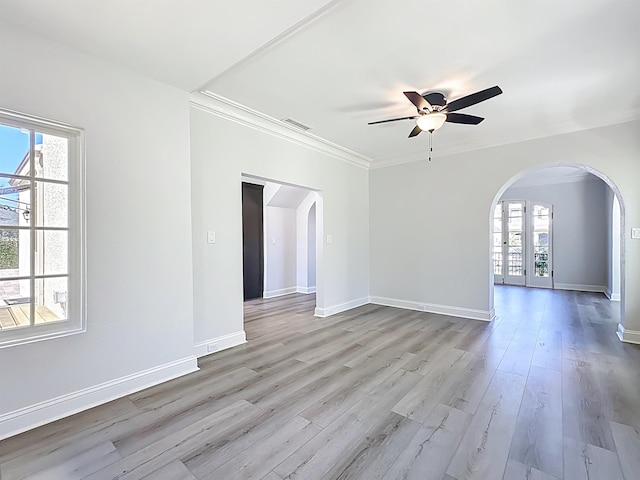 307 Minorca Ave, Saint Augustine, FL 32080 - unfurnished room with wood finished floors, visible vents, arched walkways, and a wealth of natural light
