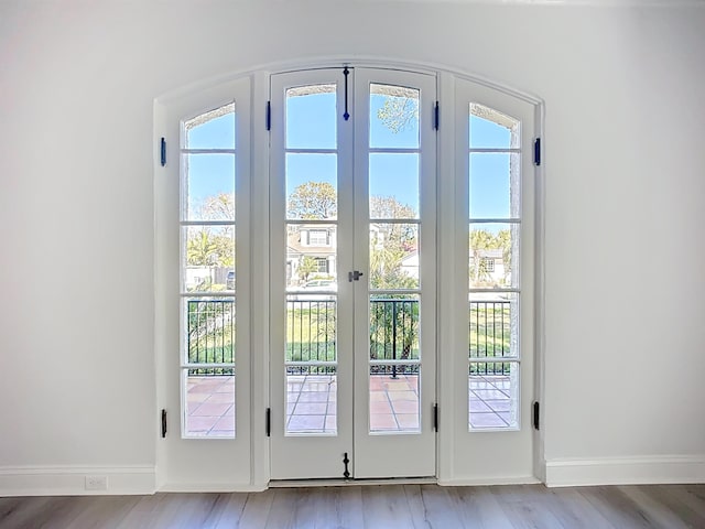 307 Minorca Ave, Saint Augustine, FL 32080 - entryway featuring light wood finished floors, french doors, and baseboards