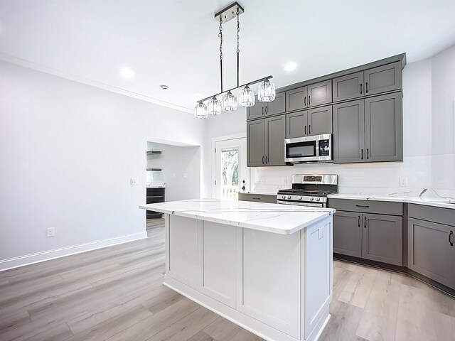 307 Minorca Ave, Saint Augustine, FL 32080 - kitchen featuring light wood finished floors, visible vents, and ornamental molding